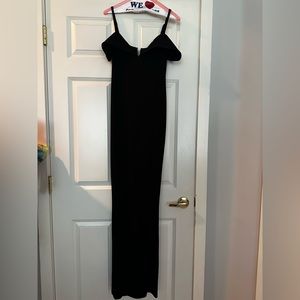 Classy black dress in size small. Adjustable straps. Already dry cleaned.